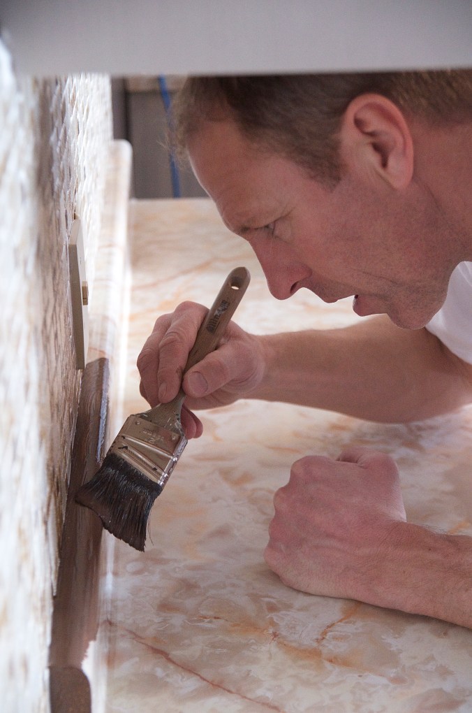 A countertop that looked like someone threw up butterscotch pudding.